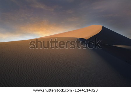 The incredible Gobi desert in Dunhuang, China during an early winter sunrise. 