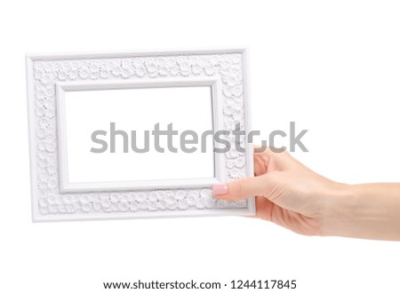 White photo frame in hand on white background. Isolation