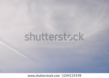 Contrails of an airplane in the sky of the Costa Blanca, Spain
