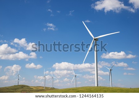 Windmills for electric power production, Soria Province, Castilla Leon, Spain. Royalty-Free Stock Photo #1244164135