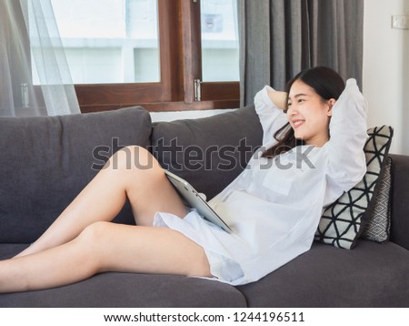 asian woman sitting and relax on sofa