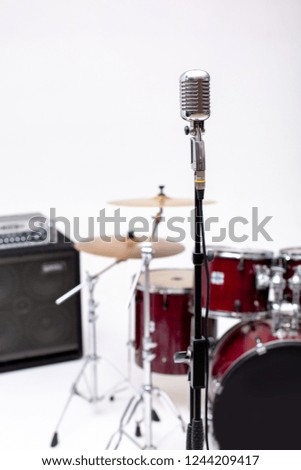 Microphone and music instrument. Microphone in a recording studio with drum on background.