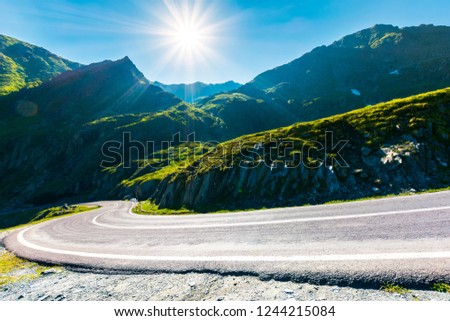 Transfagarasan road in mountains winding uphill. popular travel destination of Romania. beautiful summertime weather Royalty-Free Stock Photo #1244215084
