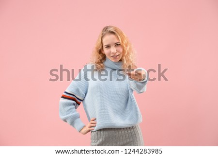 I choose you and order. The smiling business woman point you, want you, half length closeup portrait on pink studio background. The human emotions, facial expression concept. Trendy colors
