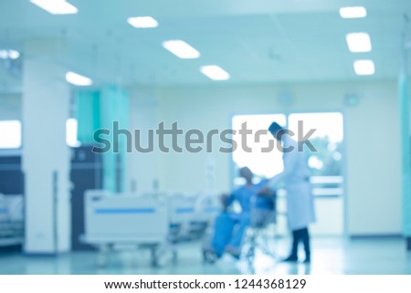 Blur the room in the hospital, the doctor, and the patient.The doctor with a wheelchair patient