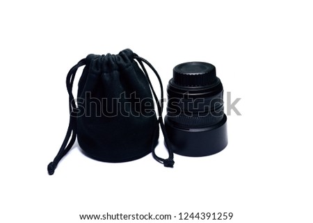 the black cloth bag with single lens reflex camera lens on white background isolated