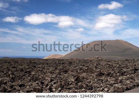 Panoramic view over waste lava field on volcano in Timanfaya NP, Lanzarote, Canary Islands