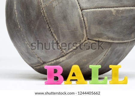   The word “Ball”, laid out in colored letters, is illustrated by a real vintage leather ball with a rich history. Made in USSR.  Education project.                        