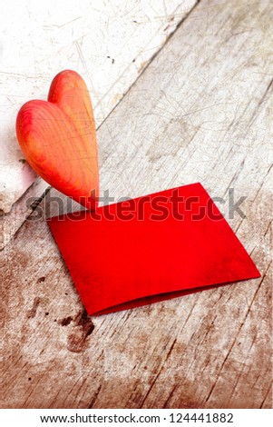 Heart as a symbol of love/vintage card with red heart on grunge old background/valentines day background