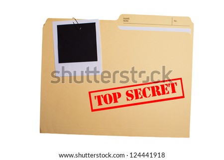A folder with TOP SECRET stamped across the front and a blank photograph clipped to it Royalty-Free Stock Photo #124441918