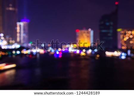 Night twilight blurred light bokeh in downtown bangkok abstract background.