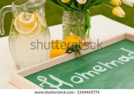 horizontal natural light photo of homemade lemonade at the table for sale