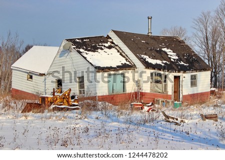 An abandoned house with major structural issues. Royalty-Free Stock Photo #1244478202