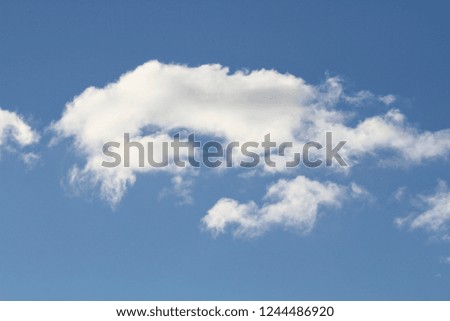 Puffy White Clouds on Brilliant Blue Autumn Sky