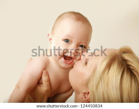Mother holding baby Royalty-Free Stock Photo #124450834