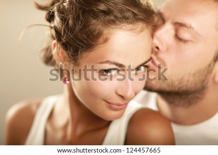 Young man and woman together over white background Royalty-Free Stock Photo #124457665