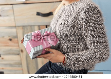 beautiful girl opens a present