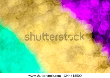 Abstract background colorful blurred bokeh of light moving around from a light led footage in night garden party tunnel pattern for christmas and new year background.