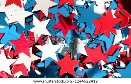 4th of July American Independence Day. Star confetti decorations on white background.  Flat lay, top view, copy space