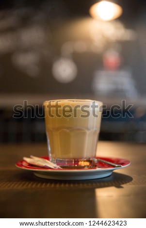 Coffee in glass on the table in cafe