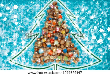 merry christmas and happy new year CARD background handmade handicraft garland of colored acorns - blurred picture 