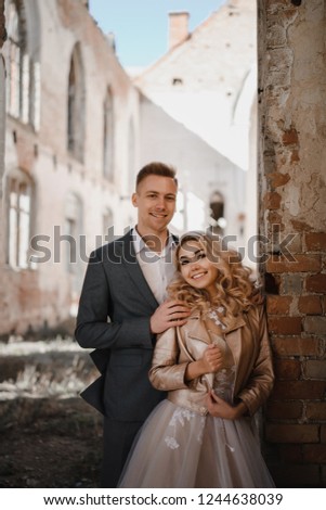 Stylish wedding photo shoot in a ruined building.
