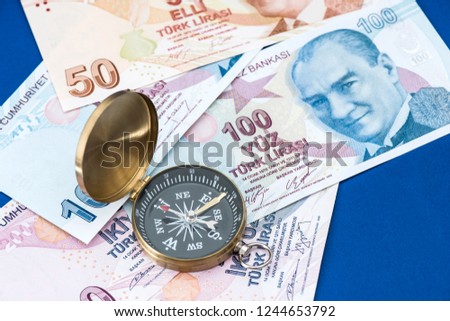 Compass and Turkish Lira Banknotes money. Financial concept.
