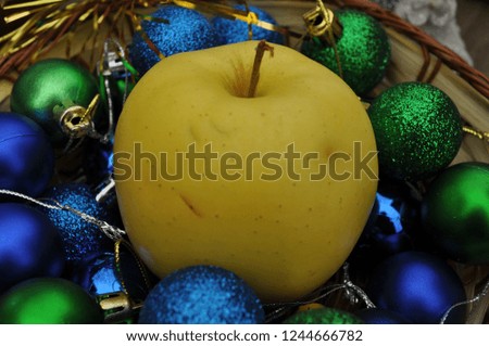 Christmas balls and apple
