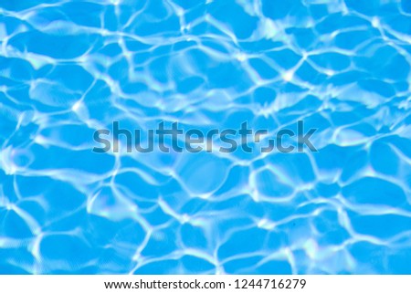 Water in swimming pool blue background