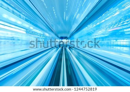 Speed Motion Blur Line of Railway Tunnel and Light at the end of Tunnel of Airport in Blue Tone