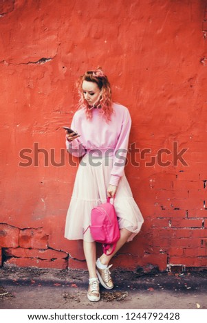Young pretty woman posing in the street with phone, outdoor portrait, hipster girls, sisters, chic, tablet, internet, using smartphone, close-up fashion model, post in instagram, facebook, USA
