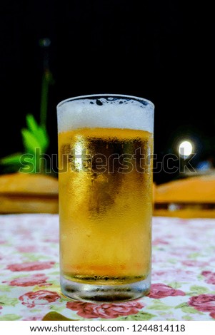 glass of beer on wooden background, digital photo picture as a background