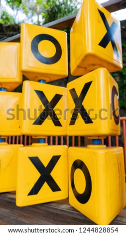 Large black and yellow noughts and crosses game for children 