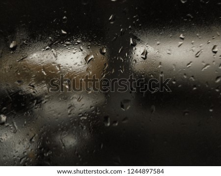 rainy city street window water drop 