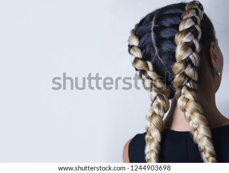 two thick braids of artificial hair, hairstyle youth, colored ha Royalty-Free Stock Photo #1244903698
