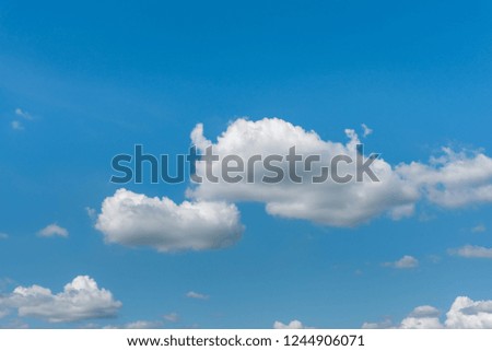 Clear blue sky with beautiful white clouds.