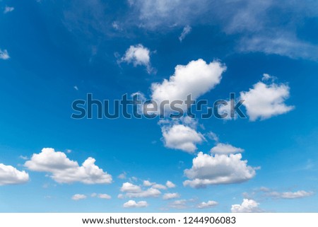 Clear blue sky with beautiful white clouds.