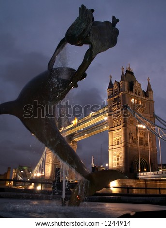 Dolphin Fountain And Tower Bridge Royalty-Free Stock Photo #1244914