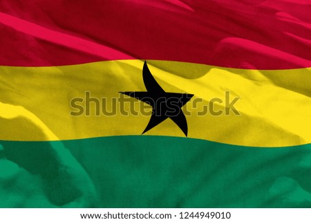 Fluttering Ghana flag for using as texture or background, the flag is waving on the wind