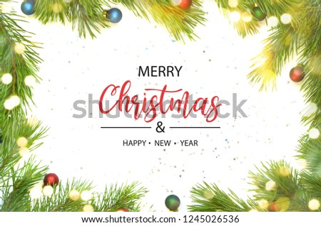 Merry Christmas and Happy New Year. Christmas frame made from pine branch and ornaments on white background.