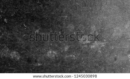 Texture of film on black background and white scratches