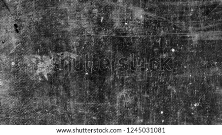 Texture of surface on black background with scratches