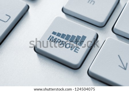 Improve button on the keyboard. Motivational concept. Toned Image.