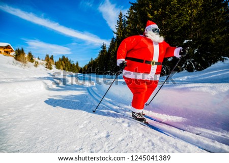 Fat Santa Claus with Christmas suits with classic  nordic ski in snowy winter mountain ski resort landscape in sunny day, New Year's or xmas is coming.