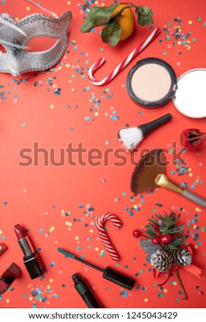 Photo on top of brushes, feather mask, tangerine, sugar cane