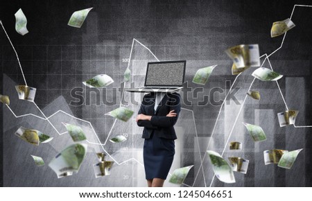 Business woman in suit with laptop instead of head keeping arms crossed while standing against flying euro banknotes and analytical charts drawn on wall on background. 3D rendering.