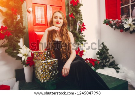 elegant and pretty lady at home celebrate christmas