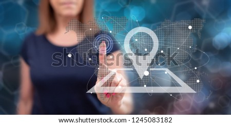 Woman touching a gps concept on a touch screen with her finger