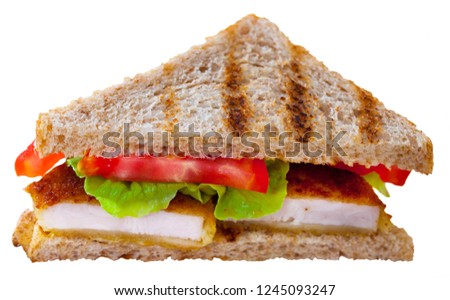 Delicious sandwich with  fried chicken nuggets, lettuce and tomatoe. Isolated over white background