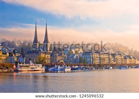 Town of Luzern morning fog view from lake, central Switzerland Royalty-Free Stock Photo #1245096532